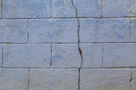 Old rough textured surface of a grunge wall with a crack. Backgroundの写真素材