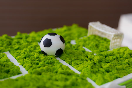 Cake with a classic soccer ball. Selective focus on blurred background.の写真素材