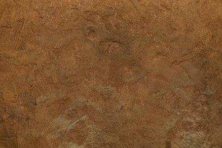 Rough textured natural stone surface. A graphic resource or template for a design.