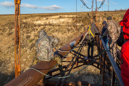 December 6, 2020 Rezina, Moldova Rope jumping is an extreme type of recreation. Selective focus with...