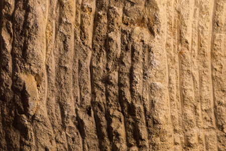 Rough textured natural stone surface. A graphic resource or template for a design. Wallの写真素材