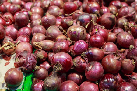 Farmers onions on the counter. A department in a store or supermarket with fresh fruits and vegetables. Backgroundの写真素材