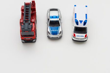 January 8, 2020 Balti Moldova toy cars of the FIRE SERVICE, POLICE and AMBULANCE on a light background. Important structures in emergency services.のeditorial素材