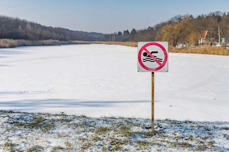 A frozen lake or body of water in the winter snowy season. Backgroundの写真素材