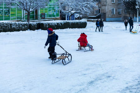 February 1, 2021 Balti or Beltsy, Moldova evening sledding on the citys central hill. Illustrative...