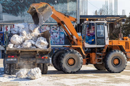 February 13, 2021 Balti or Beltsy, heavy equipment in the municipal service of the city. Illustrative editorial. Snow removalのeditorial素材