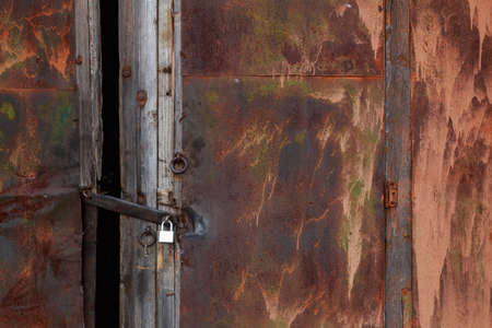 Doors of an old abandoned industrial building or hangar. Background