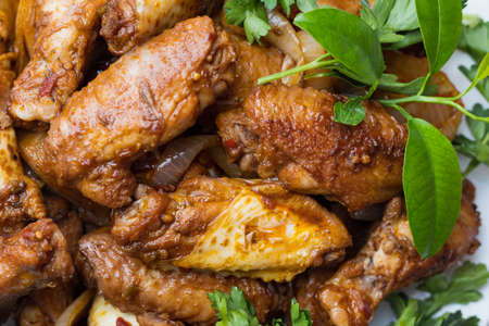 Fried chicken wings. A dish for preparing dinner for beer or wine at home. Selective focus. Backgroundの写真素材