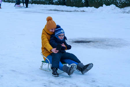 February 1, 2021 Balti or Beltsy, Moldova evening sledding on the citys central hill. Illustrative editorial. Backgroundのeditorial素材