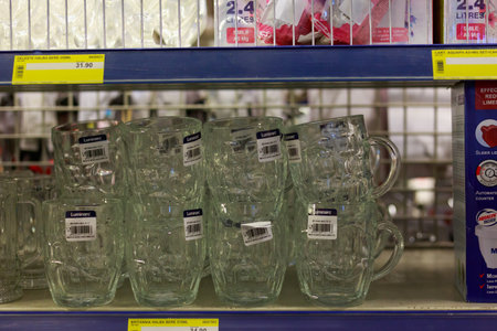March 23, 2021 Balti Moldova supermarket or wholesale hypermarket. Department of goods for the kitchen. Illustrative editorial. Showcase with beer mugsのeditorial素材