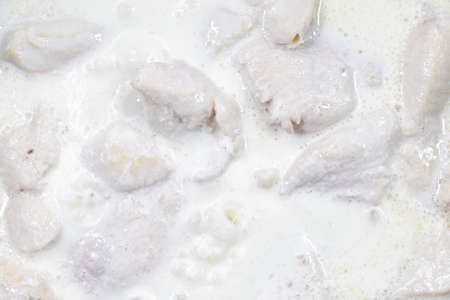 Stew chicken fillet in sour cream. Home cooking or culinary background abstract. Homemade dish.の写真素材