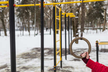 Injury playground or unsafe gymnastic equipment. Torn off ring. Copy space for text or inscriptions. Backgroundの写真素材