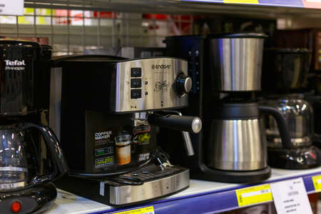 March 23, 2021 Balti Moldova supermarket or wholesale hypermarket. Department of goods for the kitchen. Illustrative editorial. Showcase with coffee makers and coffee machinesのeditorial素材