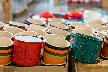 New cups or mugs on the store shelf. Selective focus with blurred background.の写真素材
