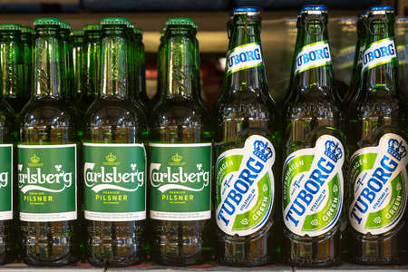 April 22, 2021 Beltsy Moldova goods on the market shelf. Supermarket showcase. Illustrative editorial. Beer bottlesのeditorial素材