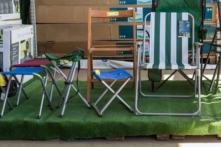 April 12, 2021 Beltsy, Moldova goods on the market shelf. Supermarket showcase. Illustrative editorial. chairs for garden and backyardのeditorial素材