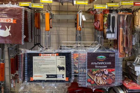 April 12, 2021 Beltsy, Moldova goods on the market shelf. Supermarket showcase. Illustrative editorial. Grills for roasting food over a fireのeditorial素材