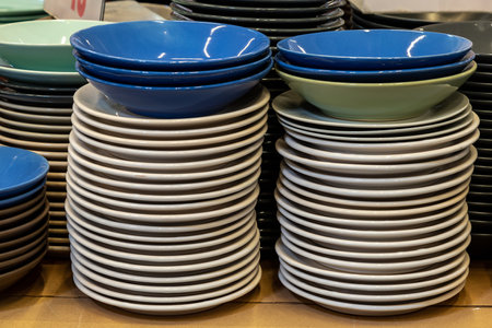 Plates and utensils in a self service store. Backgroundの写真素材