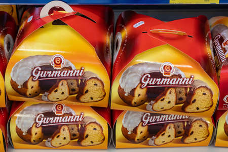 April 22, 2021 Beltsy Moldova goods on the market shelf. Supermarket showcase. Illustrative editorial. Panettone and Easter cakesのeditorial素材