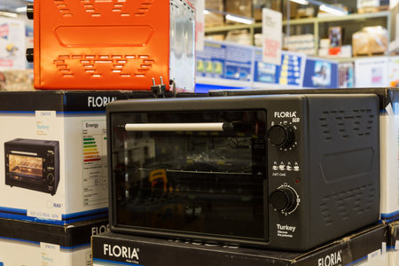 March 23, 2021 Balti Moldova supermarket or wholesale hypermarket. Department of goods for the kitchen. Illustrative editorial. Showcase with microwave ovens.のeditorial素材