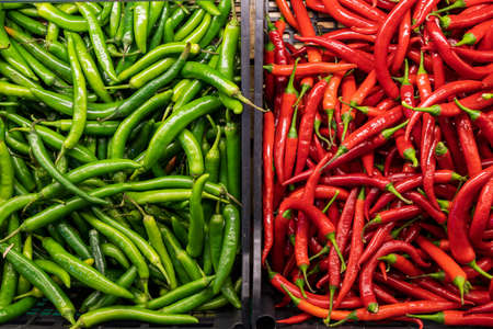 Chili peppers. Grocery store showcase or supermarket shelf.