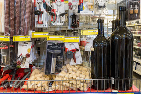 May 12, 2021 Beltsy Moldova supermarket showcase in the picnic department. Wine bottles and corks for bottling from barrels in the basement. Illustrative editorialのeditorial素材