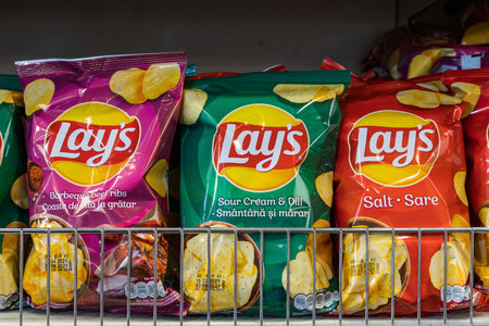 May 12, 2021 Beltsy Moldova supermarket showcase in the picnic department. Chips for a snack. Illustrative editorialのeditorial素材