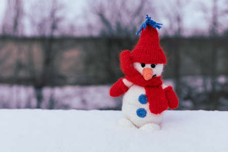 Snowman as the main symbol of winter among the peoples of the northern hemisphere of the planet. Background with place for text or inscriptions.の写真素材