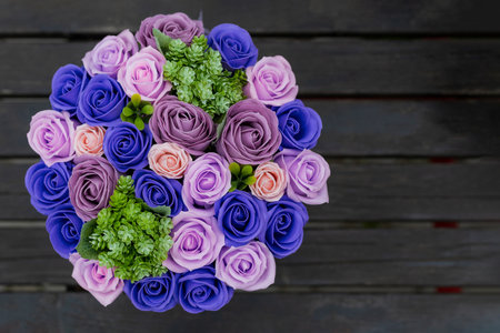 Very beautiful gift bouquet of artificial decorative roses. Background with place for text or inscriptionの写真素材