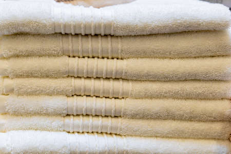 A stack of folded towels. Personal hygiene and freshness symbol. Cleanliness and health. Backgroundの写真素材