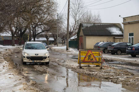 February 1, 2021 Balti or Beltsy Moldova, Road repair works in an urban environment with a bad climate. Backgroundのeditorial素材