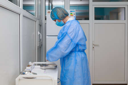 A nurse prepares vaccinations for the voluntary vaccination of the population. May 5, 2021, Balti Moldova, Illustrative editorial. Selective focus.のeditorial素材