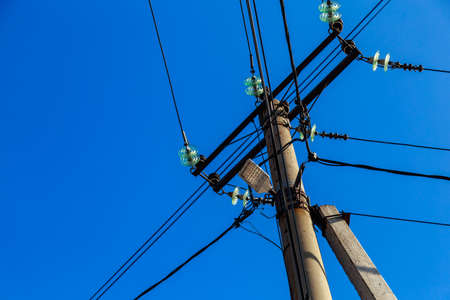 pole with electric wires. Background with copy space for text or inscriptions.の写真素材