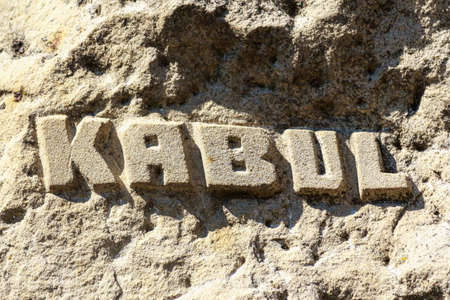 An inscription carved into an Afghan mountain or rock: KABUL. The capital and largest city of Afghanistan. Backgroundの写真素材