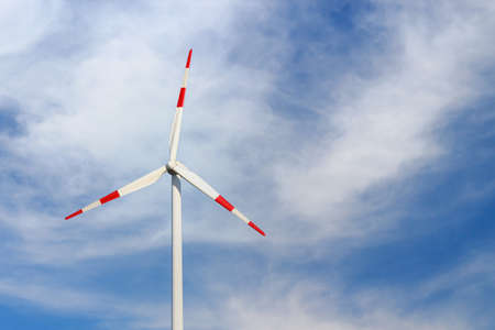 Windmills for electricity generation. Green energy concept. Background with copy space for text. Huge blades close up.の写真素材