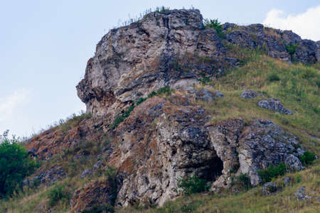 Wild hilly and rocky nature. Eastern european background with copy space for text or letteringの写真素材