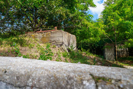 The territory of an abandoned secret military bunker. Creepy place, post-apocalyptic backgroundの写真素材