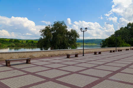 City embankment of the river. Urban and nature, background with copy space for text or lettering.