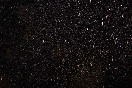 Raindrops on a black background. Rain in the dark. Graphic resource or template for editing. Blank...