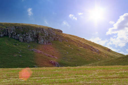 The hilly nature of Eastern Europe. Green mounds with selective focus. Landscape background with copy space for text or letteringの写真素材
