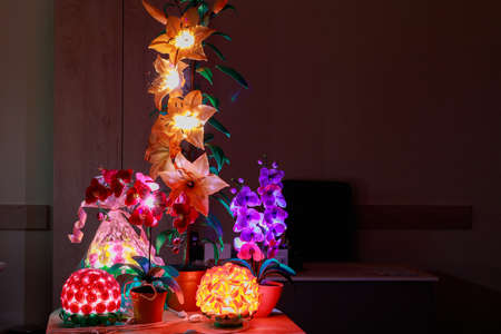 Indoor bedside lamps or flower shaped lamps. Background with copy space for text or inscriptions.の写真素材
