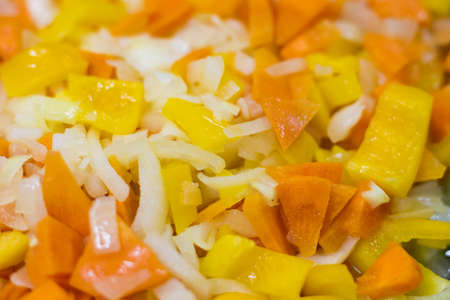 Frying vegetables in a pan. Abstract culinary background with copy space for text.の写真素材