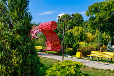 Very nice and well kept city central park. Improvement and greening of public spaces. Landscape for comfort in the city and urban environment. Background with copy space for text or inscriptions.の写真素材