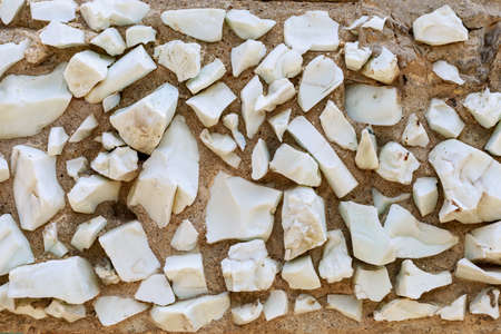 Mosaic elements in the old historical architecture of the urban environment. Rough textured background with copy space for text or lettering. Underlay blank or graphic design resourceの写真素材