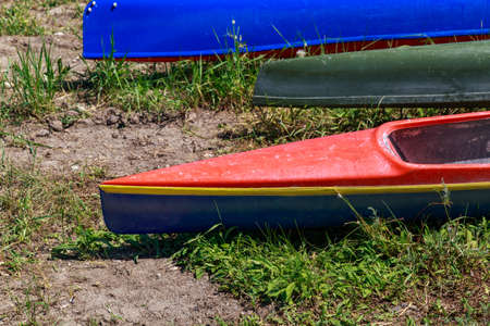 The bow of the kayak on land during the halt. Background with copy space for text. Amateur rafting.の写真素材