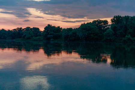 Sunset or sunrise on the river. Nature background with copy space for text or lettering.の写真素材