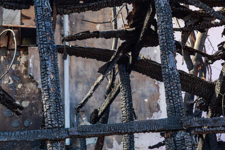 The aftermath of a fire in old wooden sheds. Backgroundの写真素材
