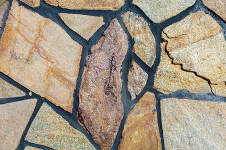 Imitation of a wild stone. Rough textured surface. Background for blank or graphic resource for design.の写真素材