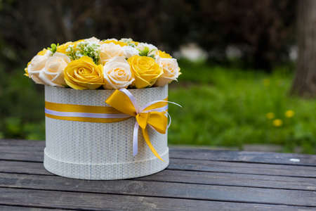 Very beautiful gift bouquet of artificial decorative roses. Background with place for text or inscriptionの写真素材