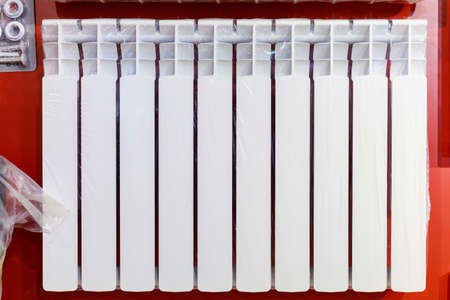 Modern white battery for gas heating. Selective focus background with copy space for text.